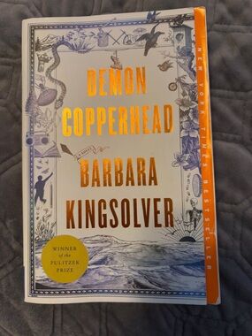 Demon Copperhead by Barbara Kingsolver — White & Orange Hardcover